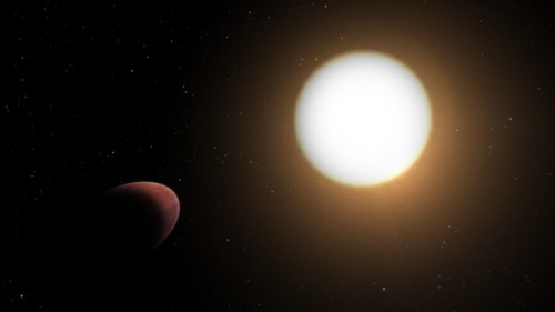 Imagem artística do exoplaneta com forma de bola de rugby, WASP-103b, a orbitar a sua estrela-mãe. A estrela WASP-103 é 1,7 vezes maior e cerca de 200 graus mais quente do que o Sol. (Crédito: ESA)